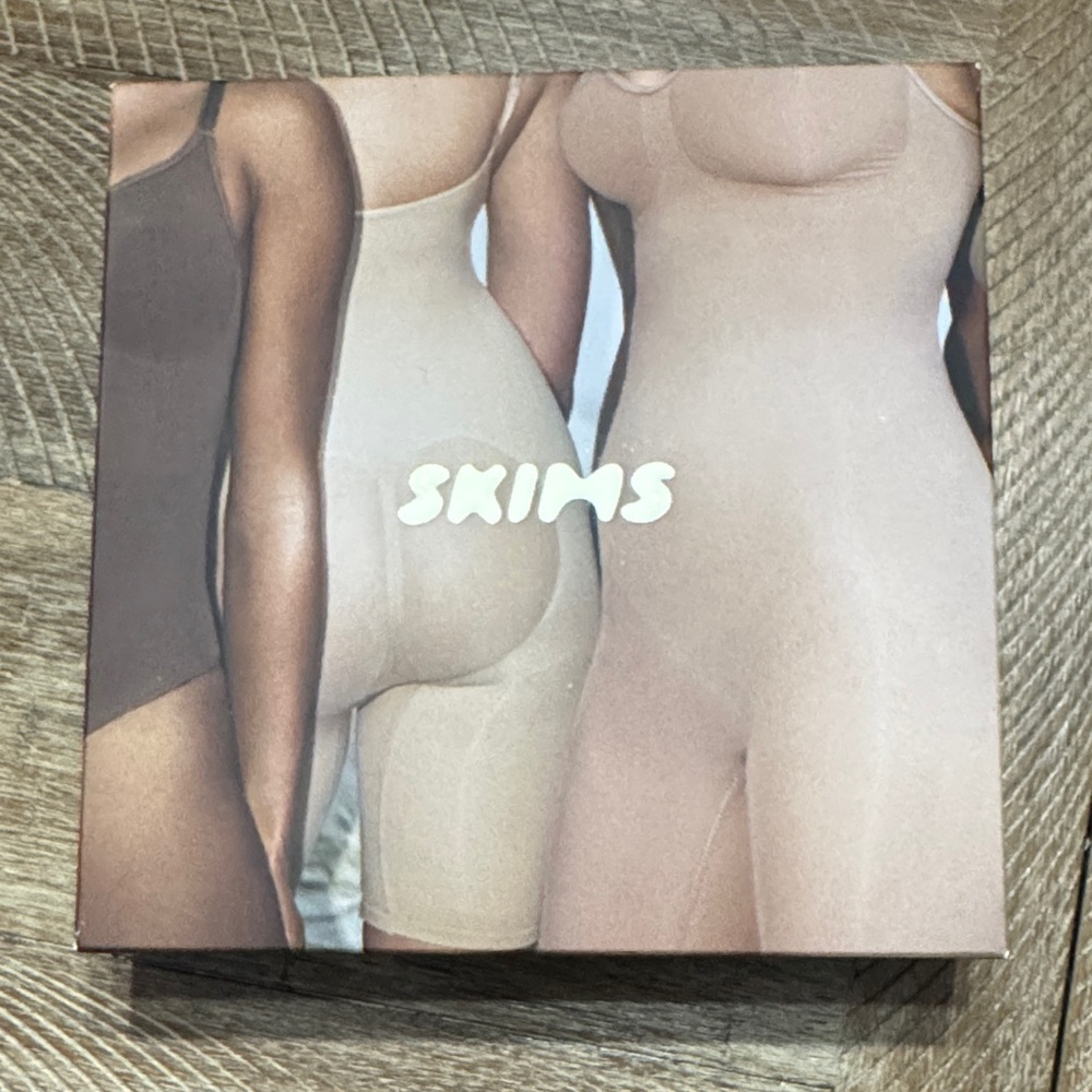 SKIMS Sculpting Bodysuit in Tan and Cream